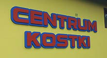 BMA - Centrum Kostki. Napisy z pomalowanego styroduru na zewnątrz siedziby firmy.